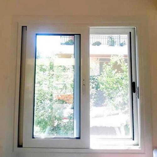 Παράθυρο συρόμενο, επάλληλο με σήτα και τζάμια ενεργειακά 4 εποχών, σειράς Europa 100
