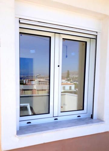 Παράθυρο ανοιγόμενο, δίφυλλο, σειράς Europa 5000 με ρολό και σήτα